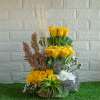 Arrangement of yellow roses , dry sticks and white chrysanthemum in a basket