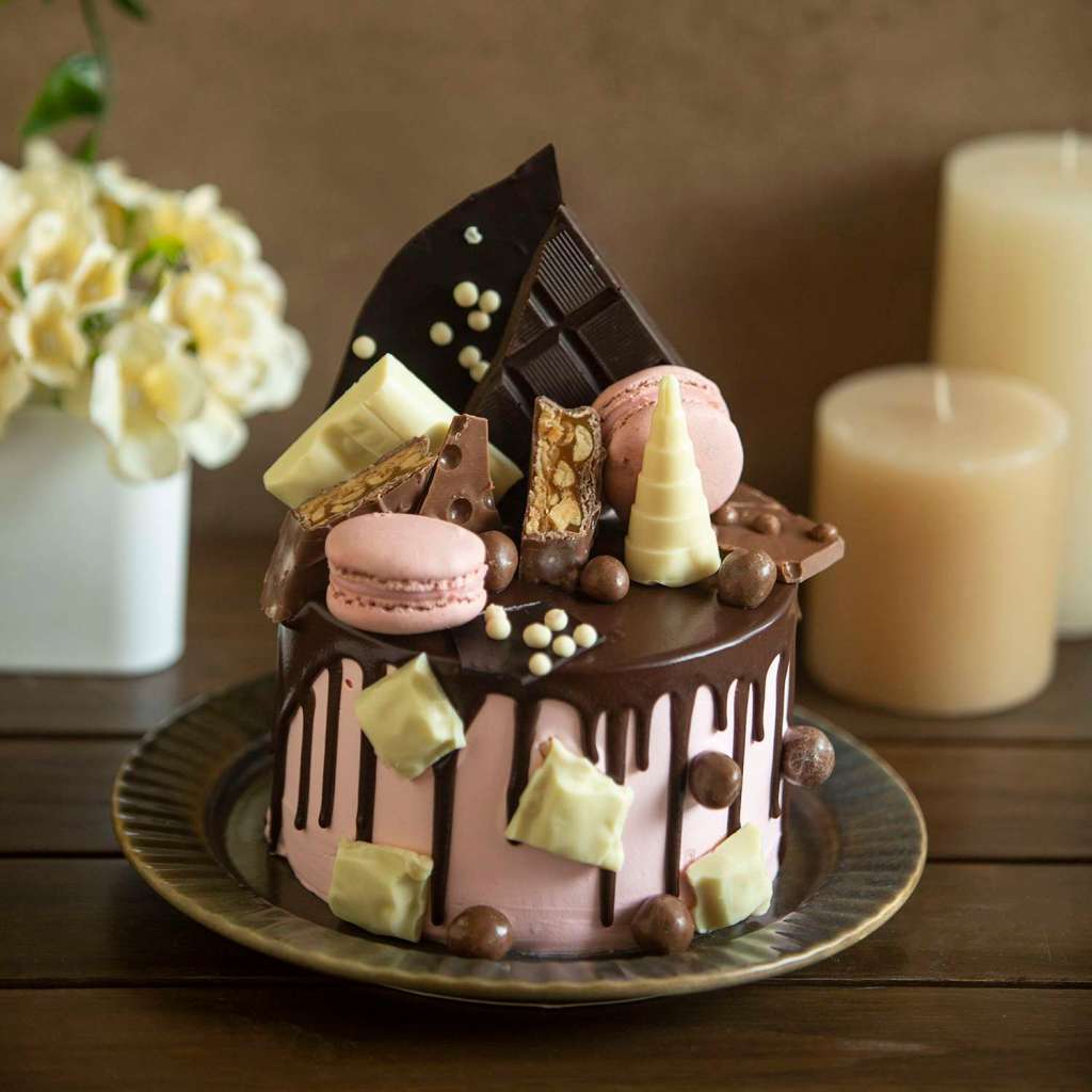 Blissful Overloaded Cake With Dark Chocolate , White Chocolate And Macarons eggless 750gms