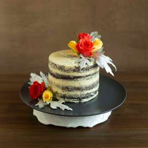 : Chocolate Sponge With French Vanilla Butter Cream ,With Orange And Yellow Roses eggless 800gms