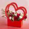 Love Handles Floral Arrangement With Red Roses And White Spray Carnations With Box Of 12 Heart Shape Raspberry Chocolates