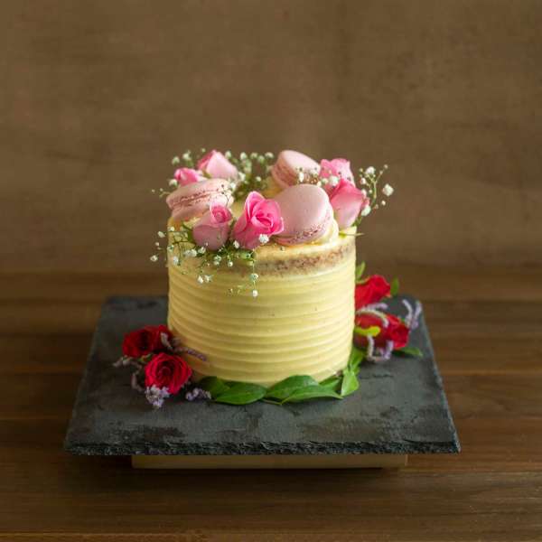 Toffee Caramel With French Vanilla Buttercream Fresh Pink Roses And Macarons eggless 800gms