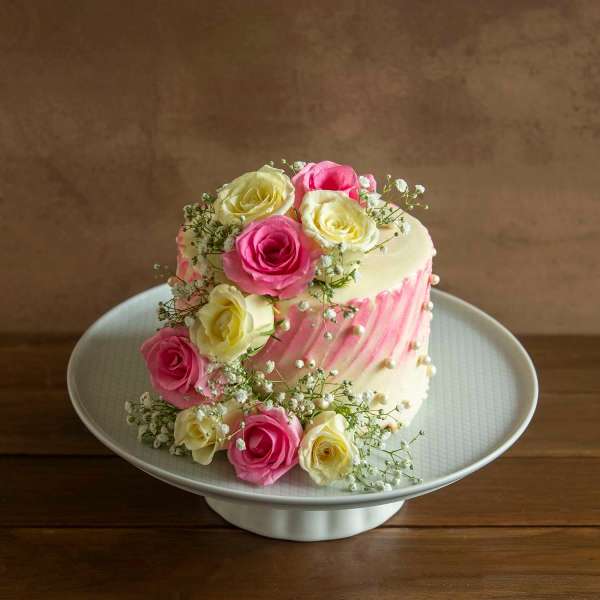 Vanilla Cake With French Vanilla Butter Cream 750gms With Pink And White Roses eggless 750gms