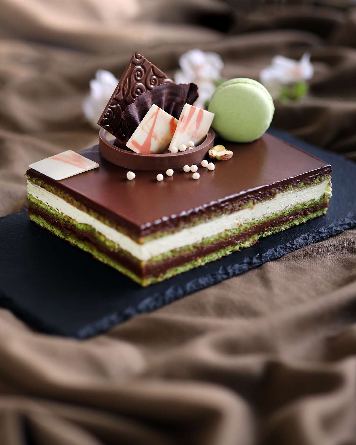 Copyright opera cake with pistachio and passion fruit. Stock Photo | Adobe  Stock